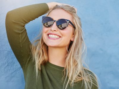 Girl with blond hair wearing sunglasses